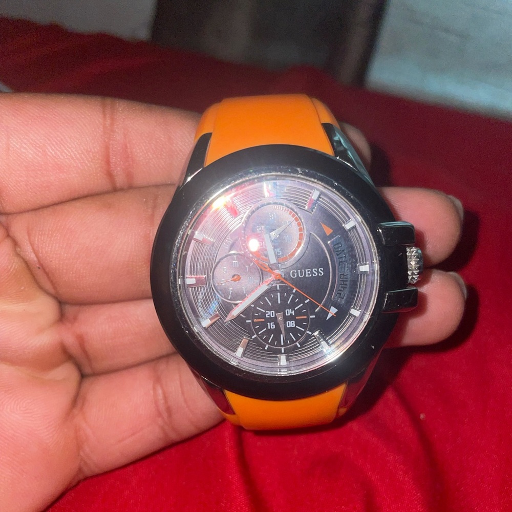Orange and black guess watch